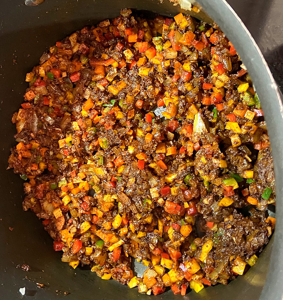 Diced onions, red, yellow, and green peppers, and jalape&ntilde;os cooked down with the first quarter of the spice mix